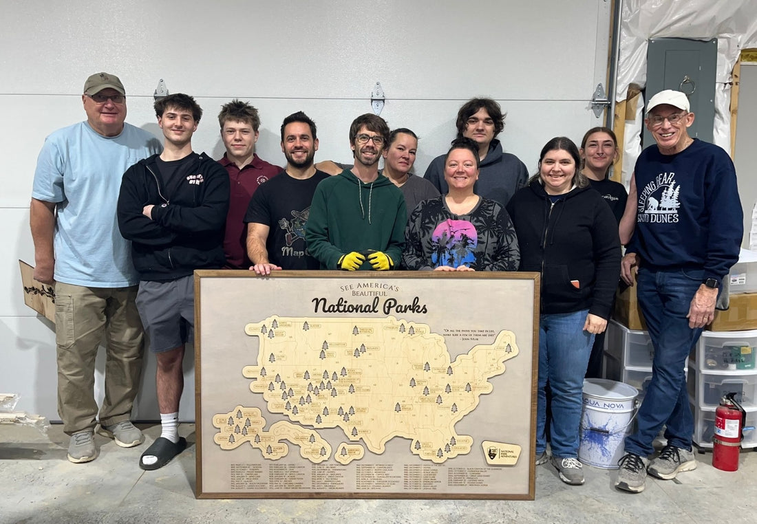 The MapCuts team together with their wooden maps