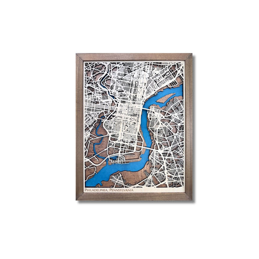 Wooden map of Philadelphia, PA, with raised roads and blue water stain.