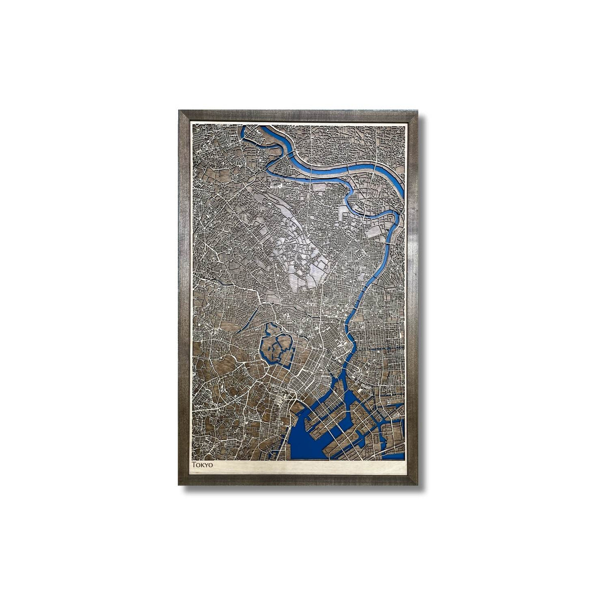 Framed wooden city map of Tokyo, Japan on a white background.
