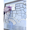 Close up of wooden US Travel Map with detachable pieces.