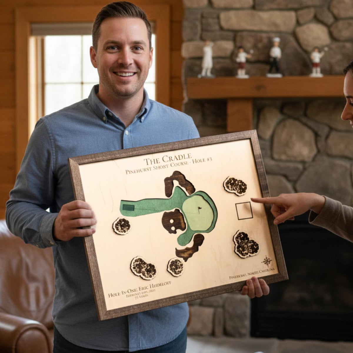 Man holding a wooden hole-in-one golf map.