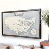 Professional Baseball Travel Map hanging on a wall above a sofa.