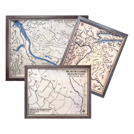 Three topographic maps of different locations with wooden frames on a white background.