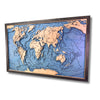 Sideview of a world map with raised topographic features in a wooden frame on a white background.