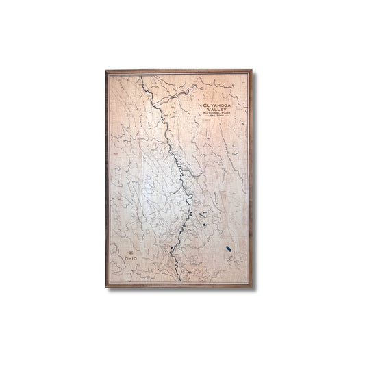 Wooden 3D topographic map of Cuyahoga Valley National Park with a wooden frame on a white background.