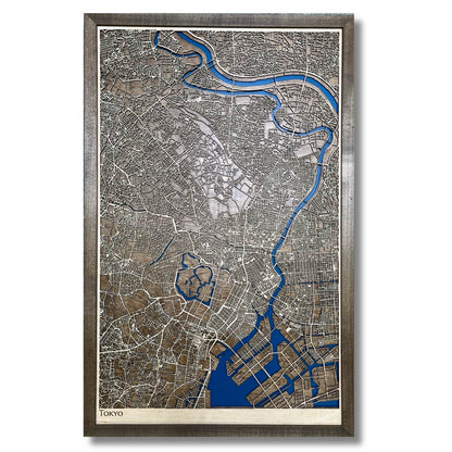 Framed wooden map of Tokyo with raised roads and recessed water layer. 