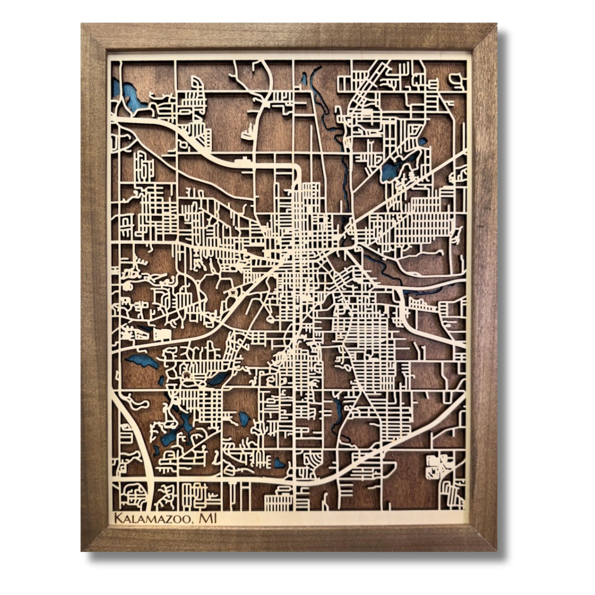 3D wooden framed city map of Kalamazoo, MI with natural wood raised roads on a darker wood base. 