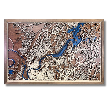 Framed wooden map of Chattanooga, TN with blue water stain, raised roads, and personalized text. 