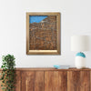 Wooden map of Cleveland, Ohio hanging on a wall above a console. 