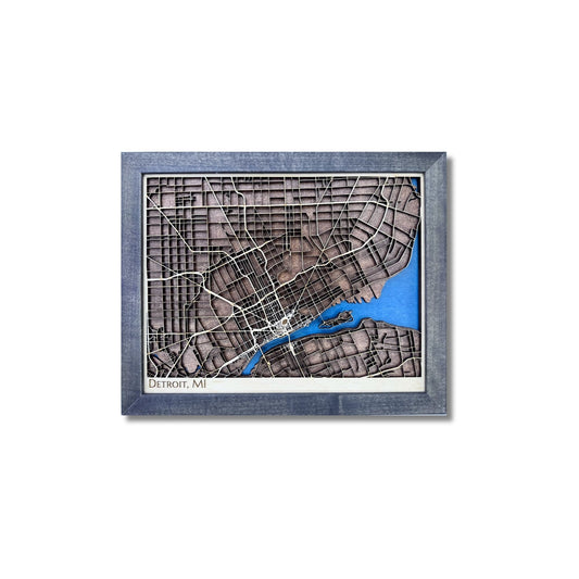Small framed wooden map of Detroit, Michigan on a white background. 