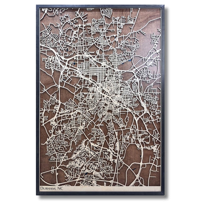 Large Durham, NC wooden map with raised light wood colored roads and a darker wood background. 
