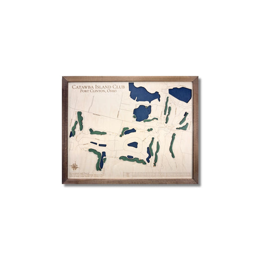 Framed wooden map of Catawba Island Club with blue water and green greens on a white background.