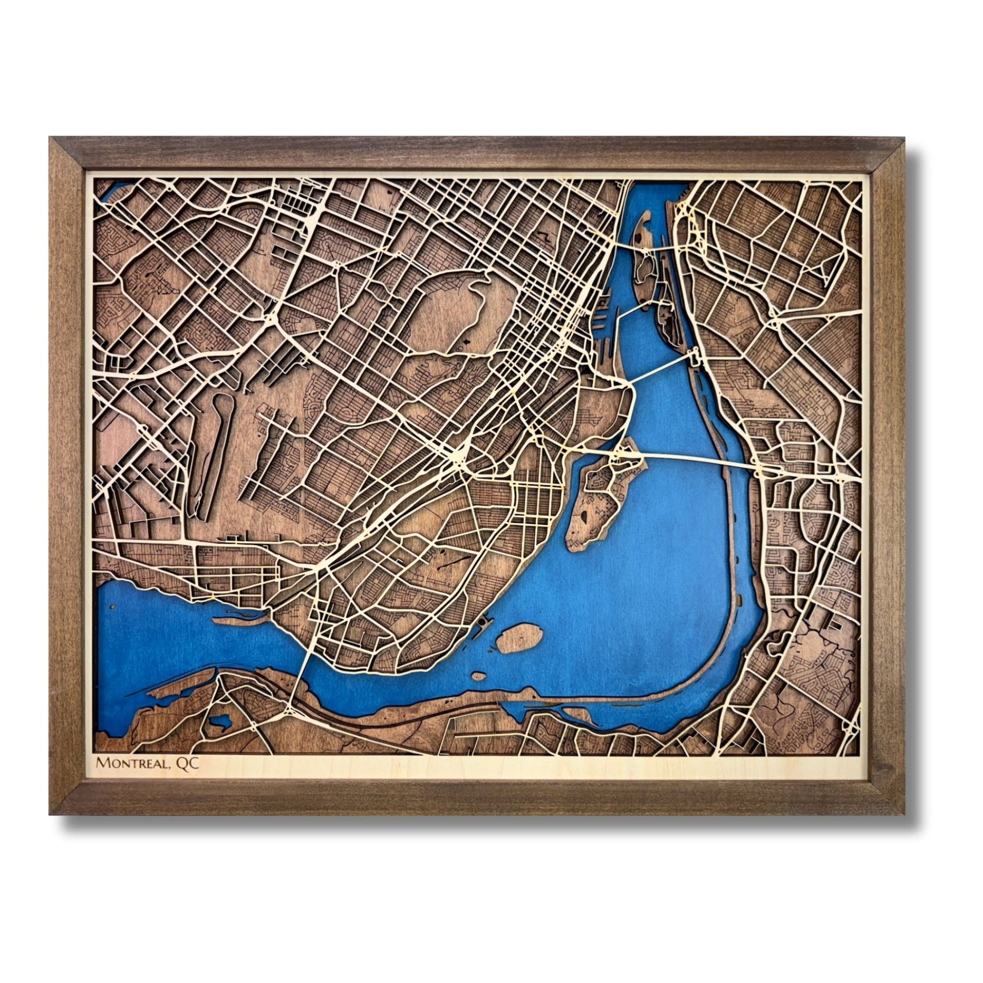 3D wooden map of Montreal with raised and engraved roads, blue water stain, and walnut brown frame. 