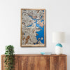 3D map of Boston, MA, hanging on a wall above a console. 