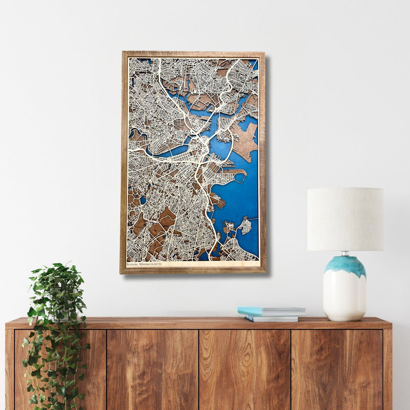 3D map of Boston, MA, hanging on a wall above a console. 