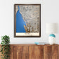 Wooden map of Buffalo, NY hanging on a wall above a console. 