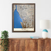 Wooden map of Buffalo, NY hanging on a wall above a console. 