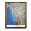 Framed wooden map of Buffalo, NY with dark blue water stain and raised roads. 