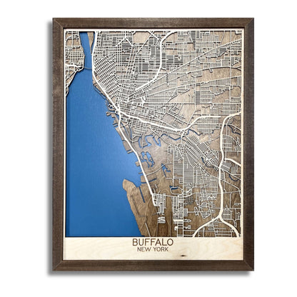 Framed wooden map of Buffalo, NY with dark blue water stain and raised roads. 