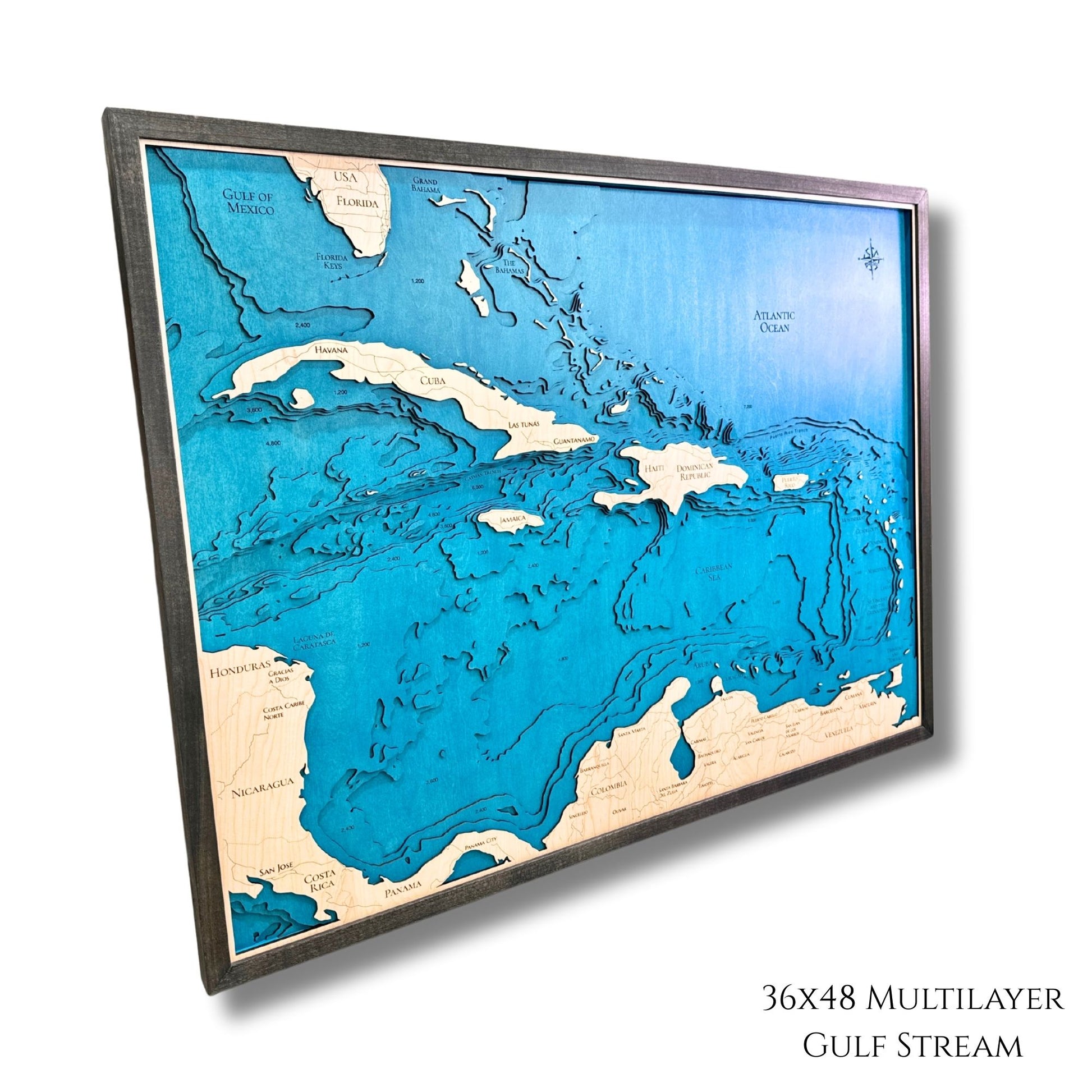 Side view of a multilayer wooden map of the Caribbean islands. 