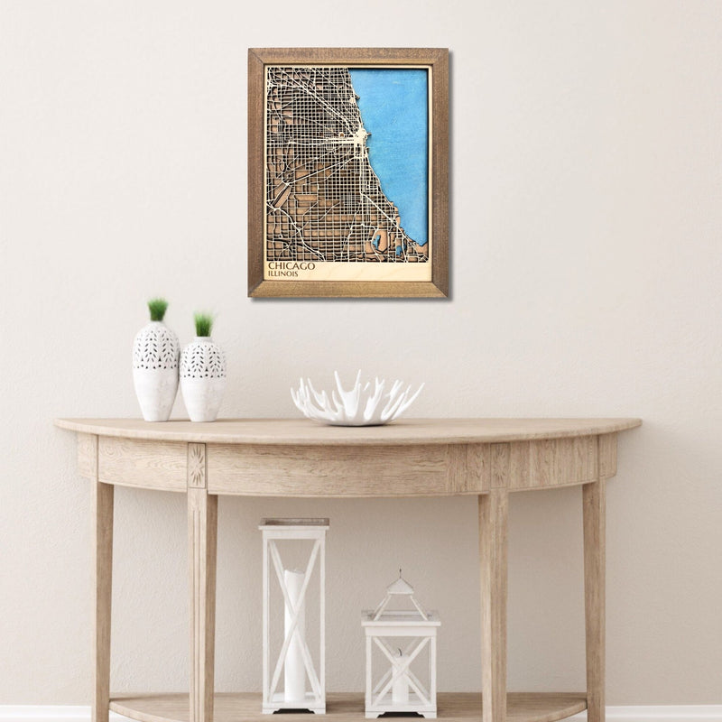 A Chicago city map hanging on the wall above a table. 