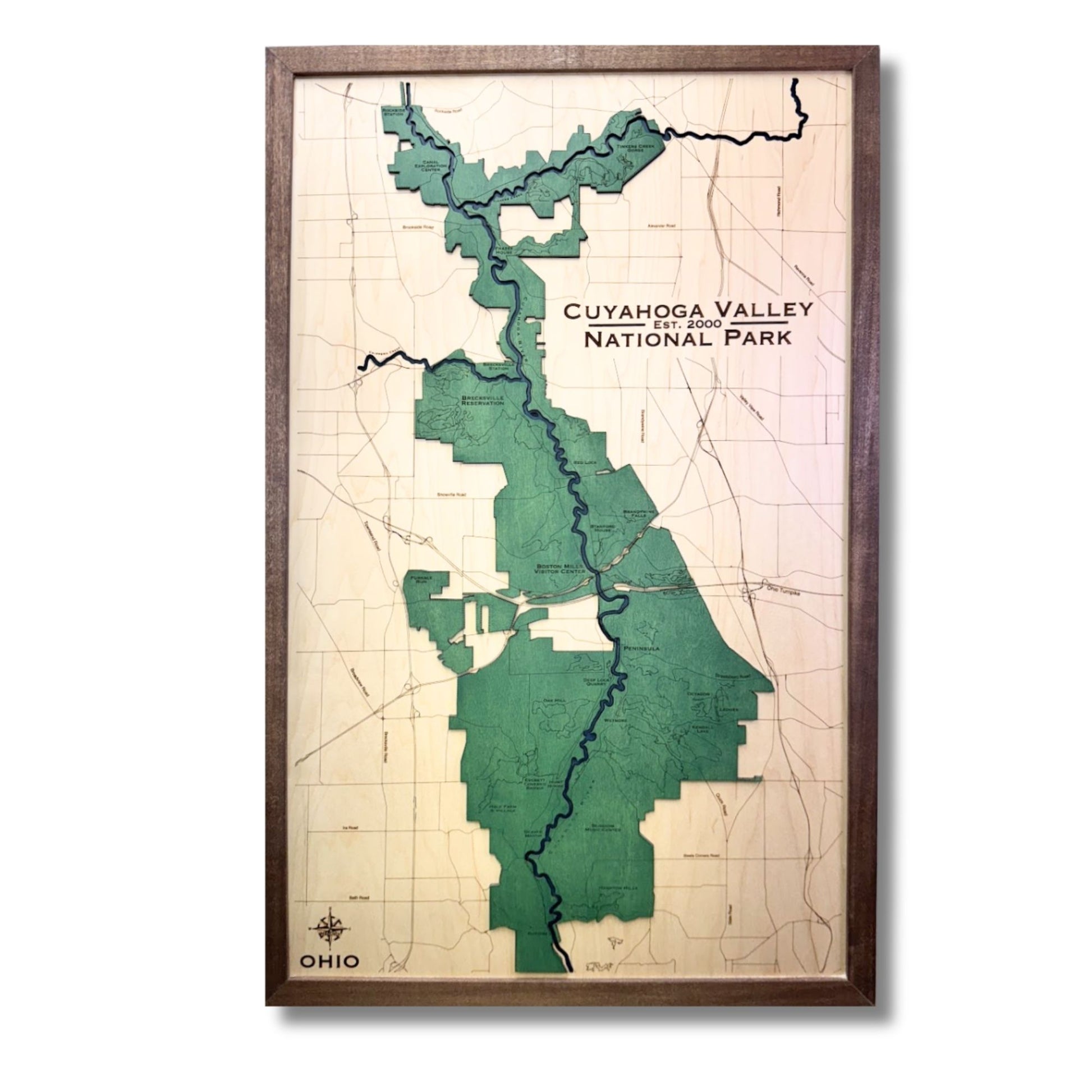 Wooden map of Cuyahoga Valley National Park with a brown frame and green park area. 