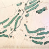 Close up of wooden golf course map with green fairways, blue water hazards, and engraved text. 