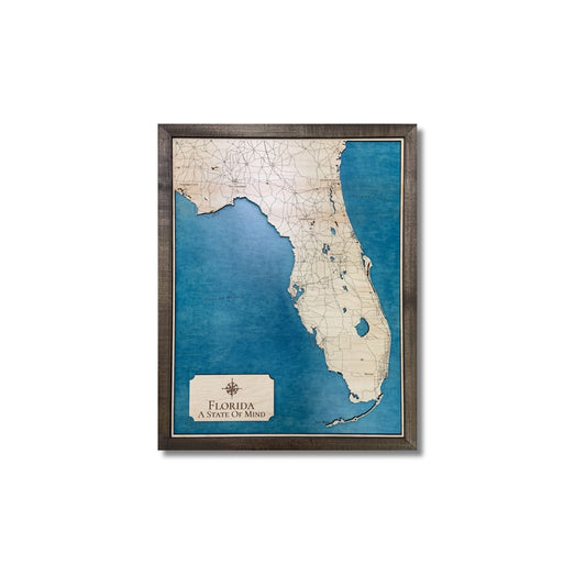 Framed wooden map of Florida and its surrounding bodies of water on a white background.