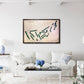 Living room with a white sofa, coffee table, and framed golf map on the wall.