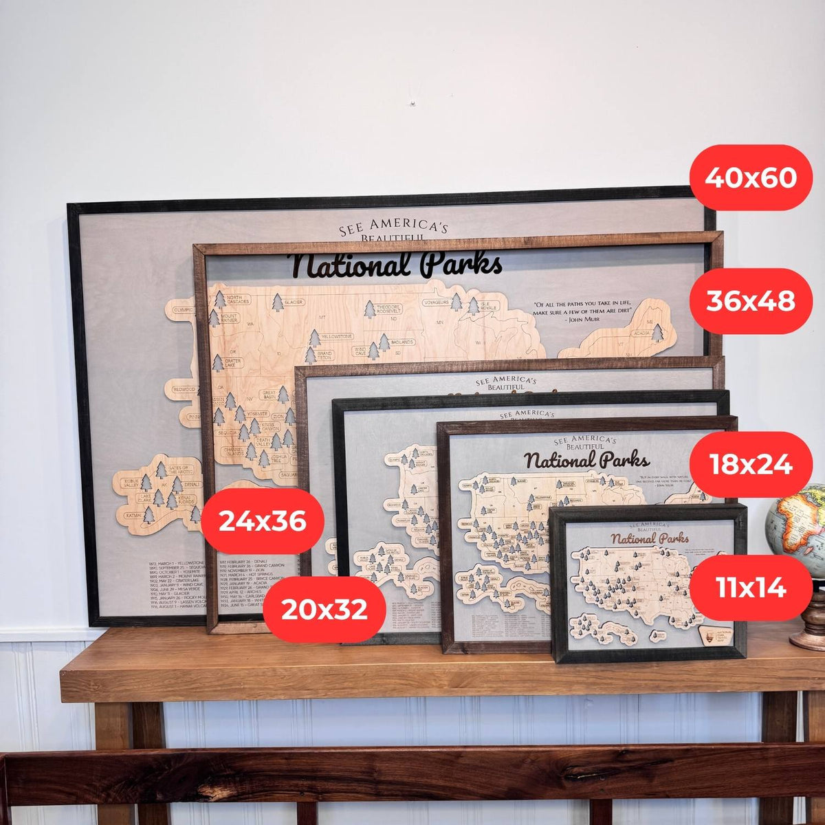 Six framed National Parks wood maps comparing sizes from 11 by 14 to 40 by 60 inches.