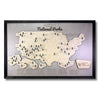 Wooden map of National Parks in the United States with a black frame and tree markers to track your travels.