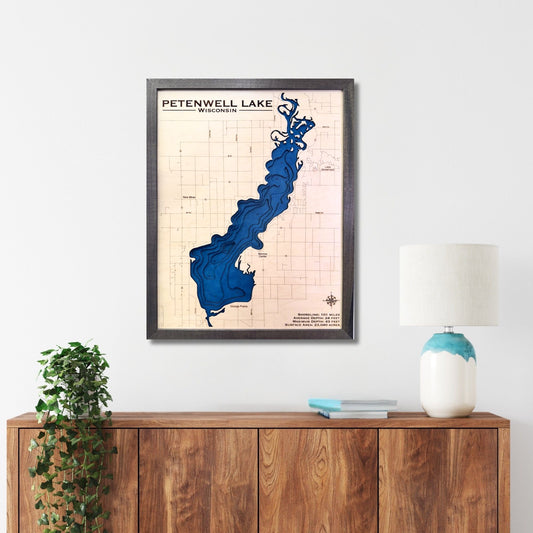 Petenwell Lake multi water layer map hanging on a wall above a console.