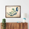 Framed map of Wollaston Golf Club on a wall above a wooden console table.