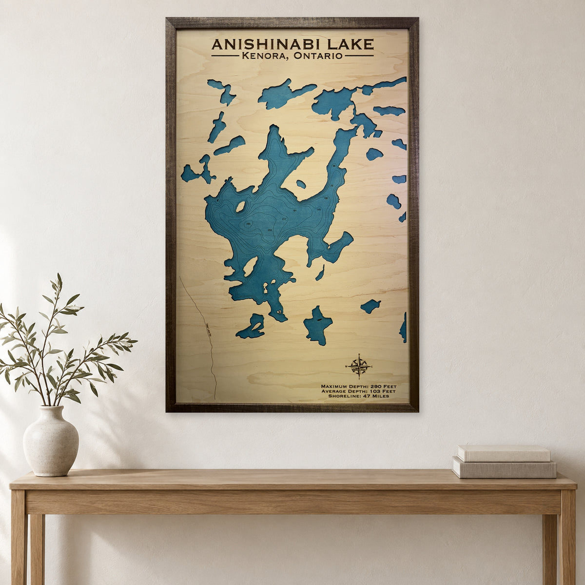 Anishinabi Kenora wood map — single layer with engraved contours, staged room mockup