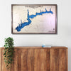 Framed map of Lake Atwood with personalized text above a wooden cabinet.