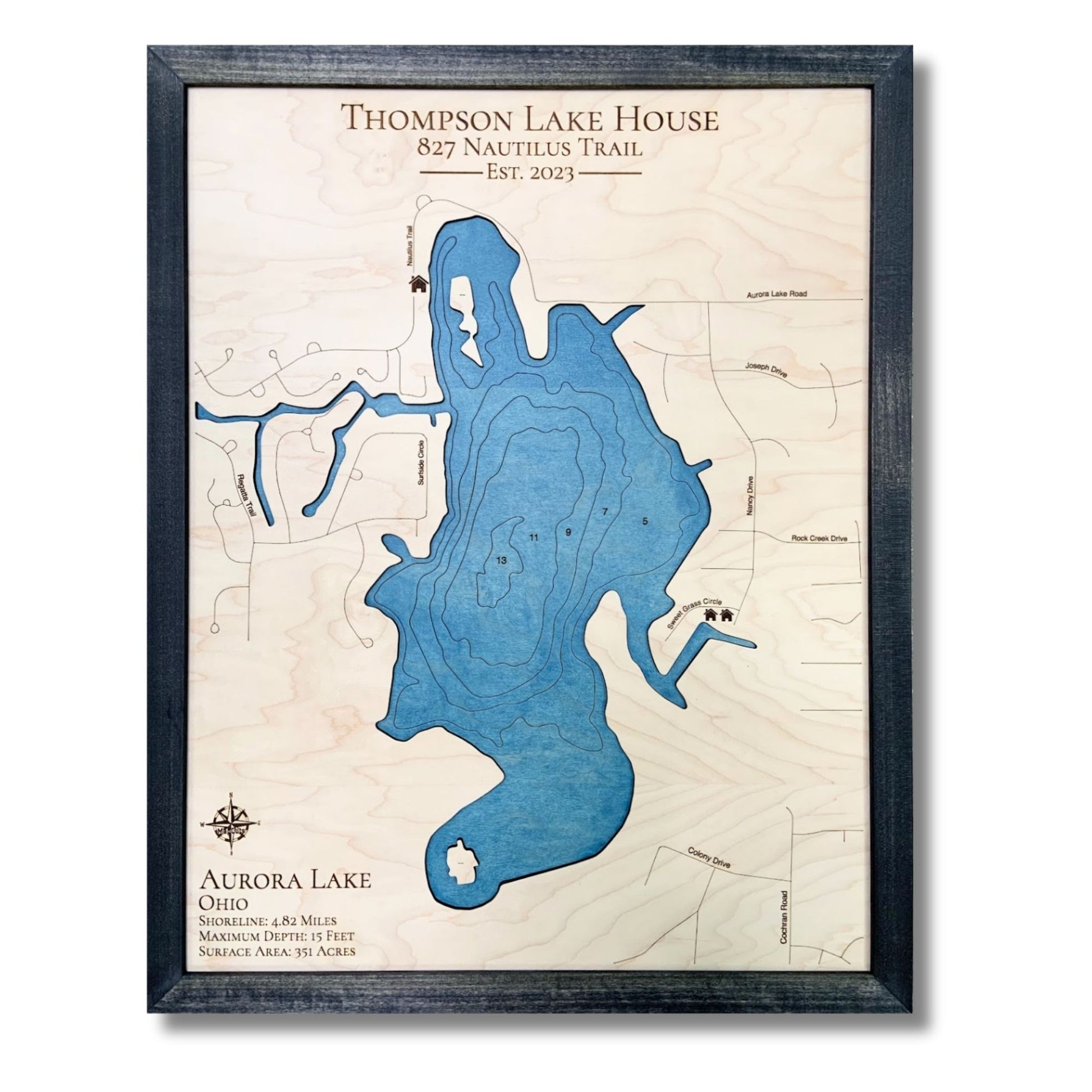 Framed engraved wooden map of Aurora Lake with personalized text and icons. 