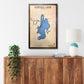 Wooden wall art of Aurora Lake, Ohio on a white wall above a wooden cabinet.