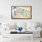 Framed wooden golf course map above a white sofa in a living room.