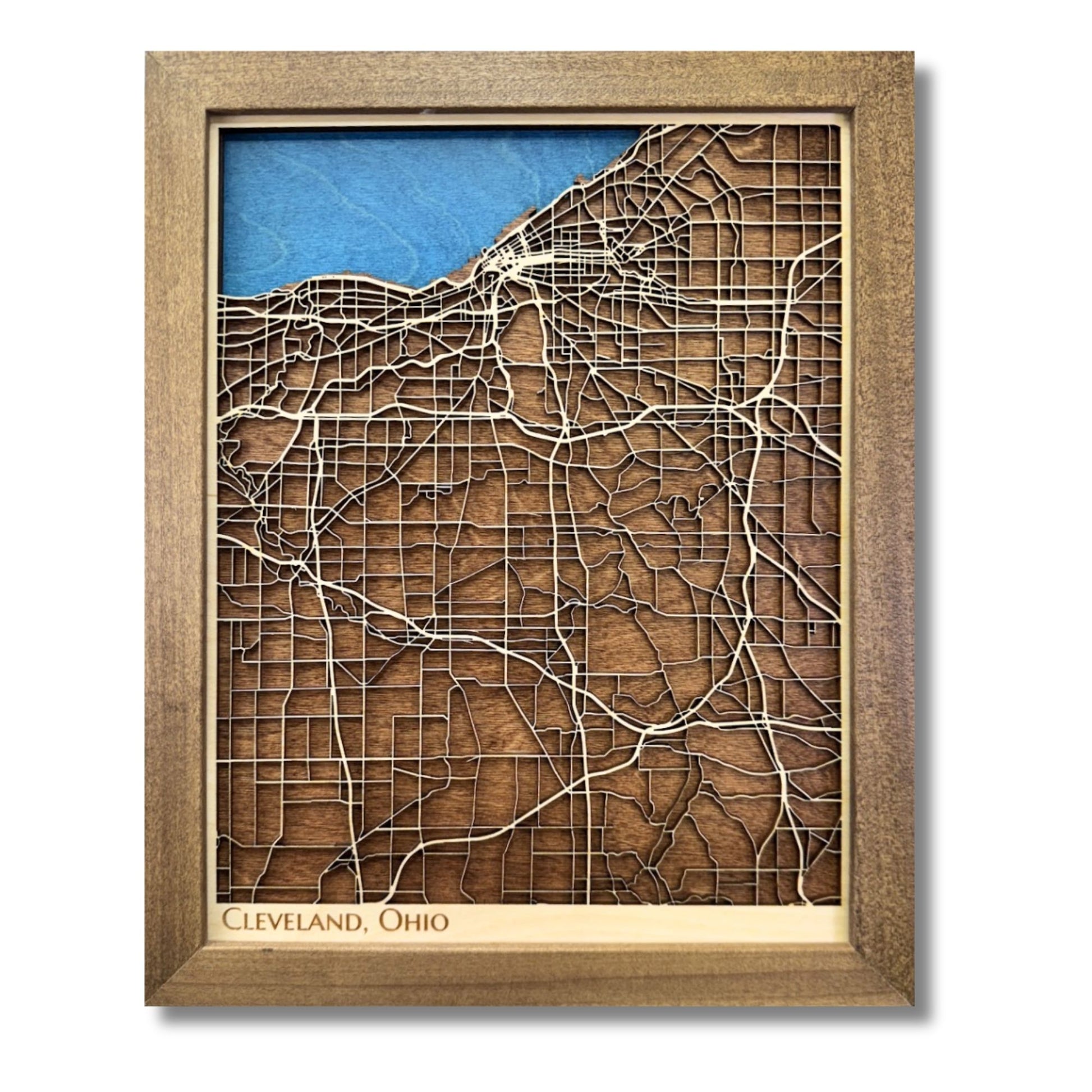 Framed 3D wooden map of Cleveland, Ohio on a white background. 