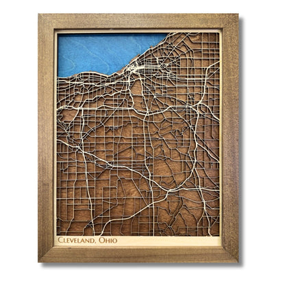 Framed 3D wooden map of Cleveland, Ohio on a white background. 