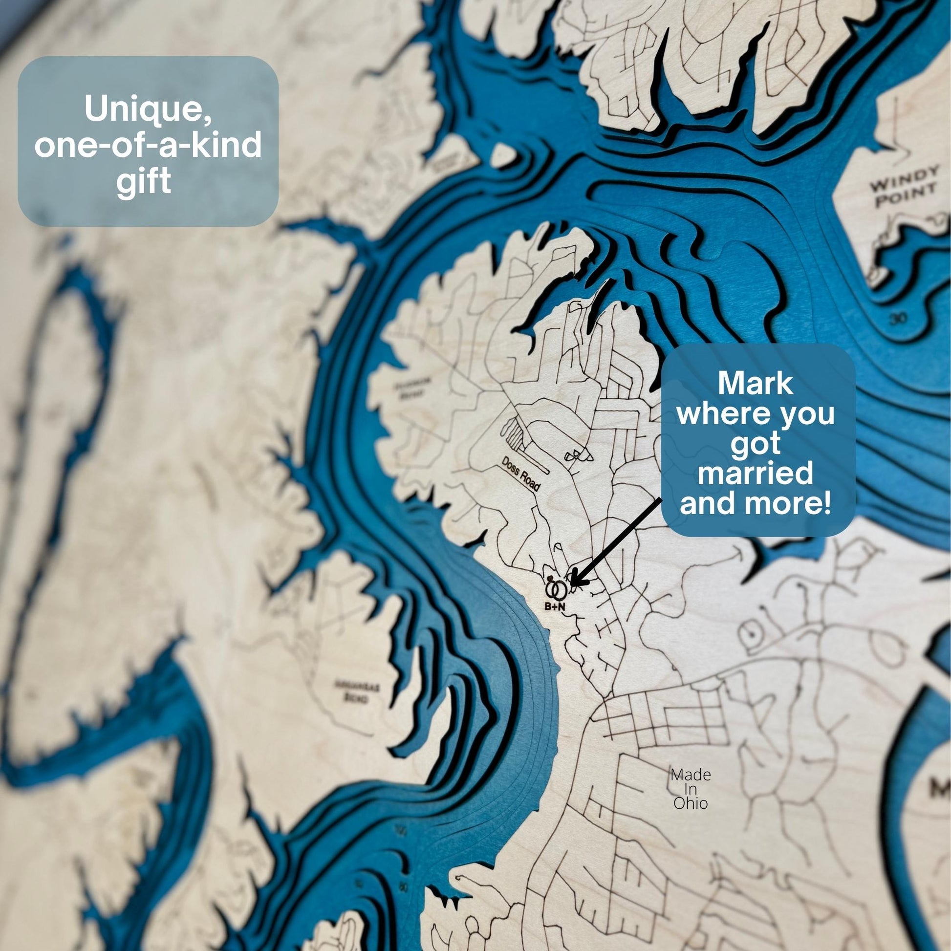 Close up view of a map showing engraved roads, icons, and the cut multi water layers. 