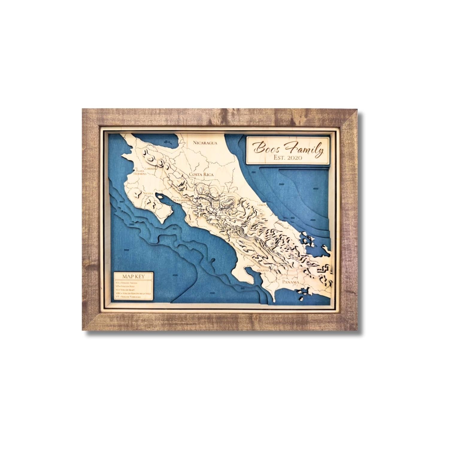 Wooden topographic map of Central America with blue stained water and layered contours. 