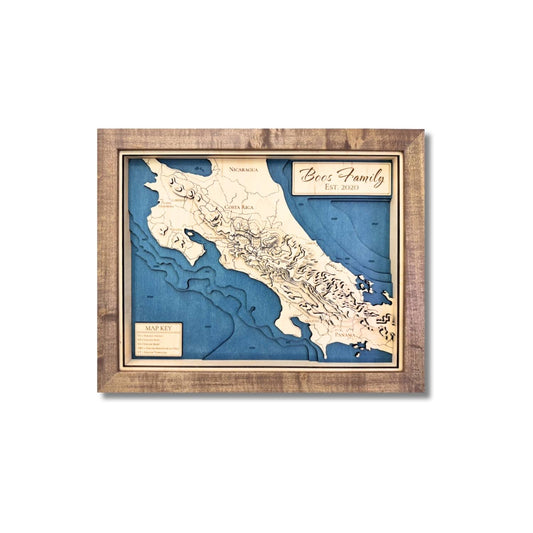 Wooden topographic map of Central America with blue stained water and layered contours. 