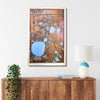 Custom wooden city map hanging on wall above a console. 