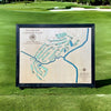 Custom wooden golf map sitting on a golf green. 