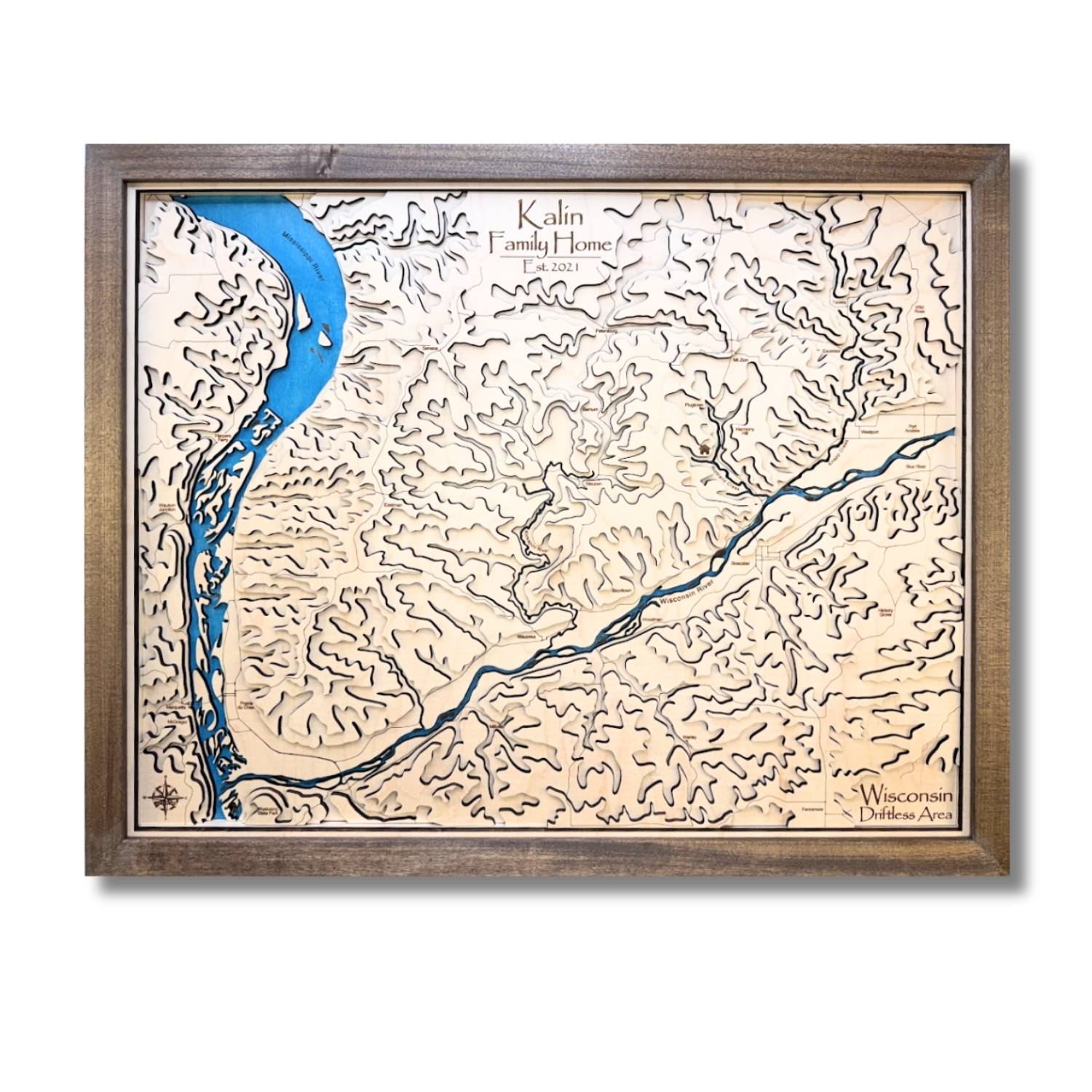 Wooden topographic map with a blue stained river and raised terrain contours. 