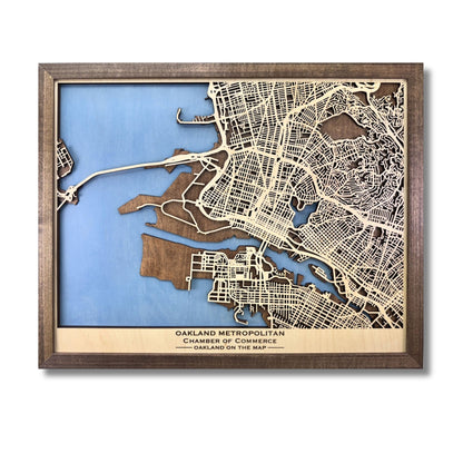 Custom city map showing light blue water stain, walnut brown frame, and personalized text. 