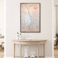 Framed topographic map on a wall above a wooden console table with decorative items.