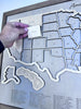 Close up of wooden US Travel Map with detachable pieces. 