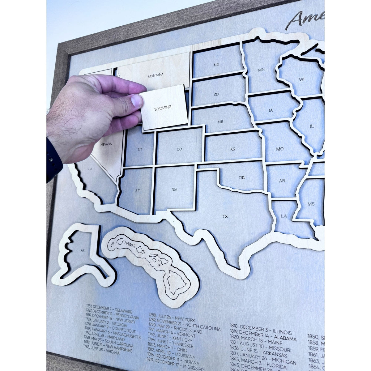 Close up of wooden US Travel Map with detachable pieces. 
